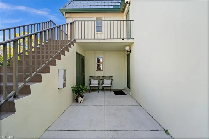 View of patio featuring stairway