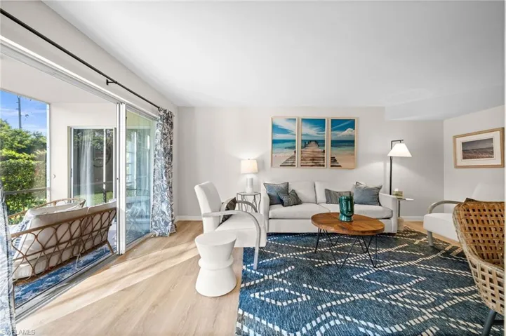 Living room with wood finished floors and baseboards