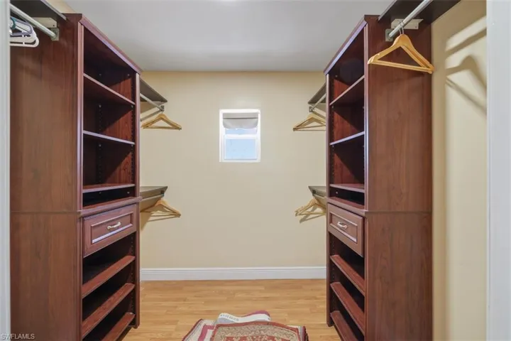 Walk in closet featuring light wood-type flooring