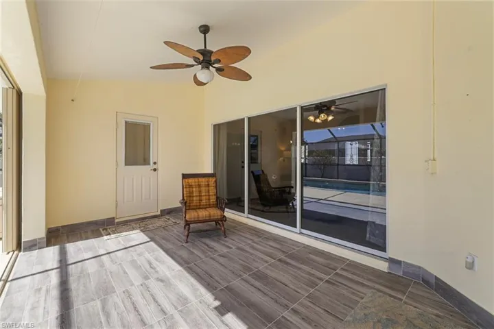 Wooden deck with a ceiling fan and a patio