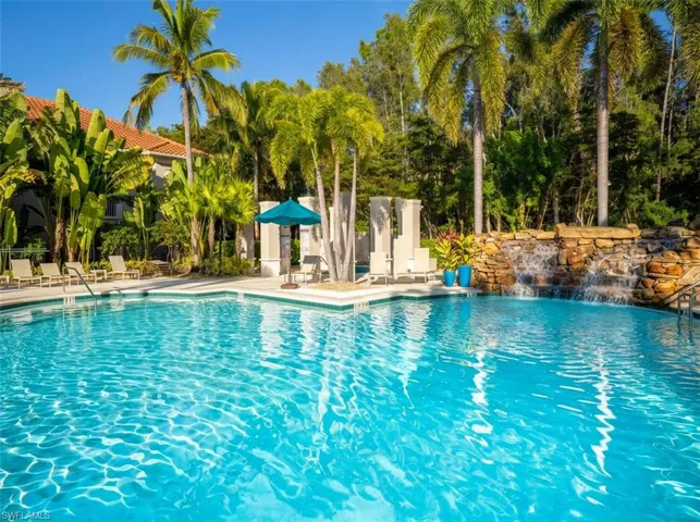 Community pool with a patio area