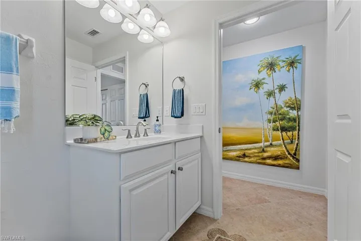 Bathroom featuring vanity and light tile patterned floors