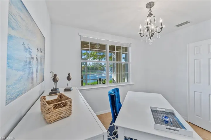 Office with baseboards and a chandelier