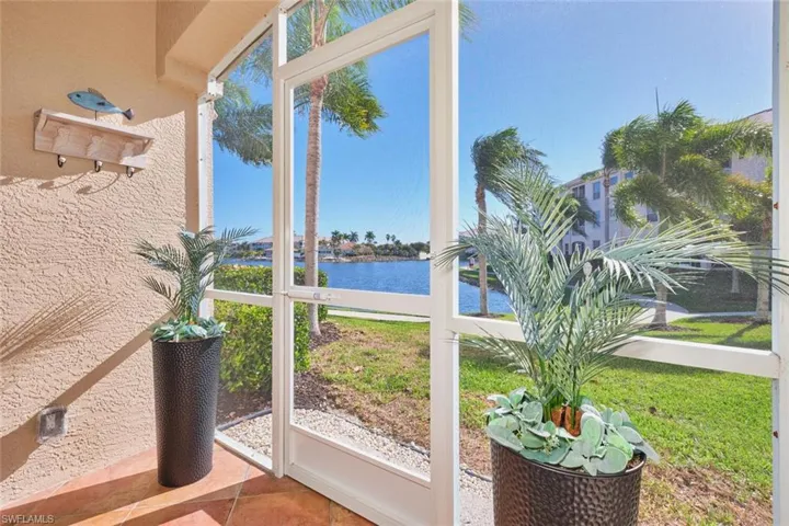 Unfurnished sunroom with a water view