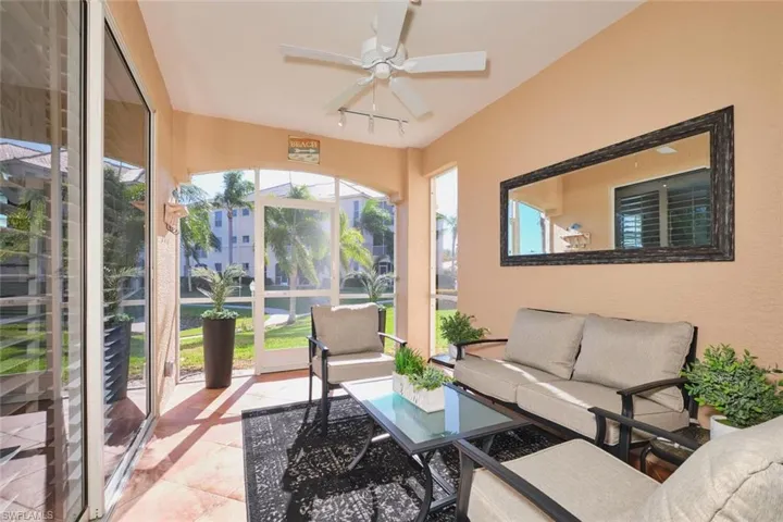 Sunroom / solarium featuring tile patterned floors