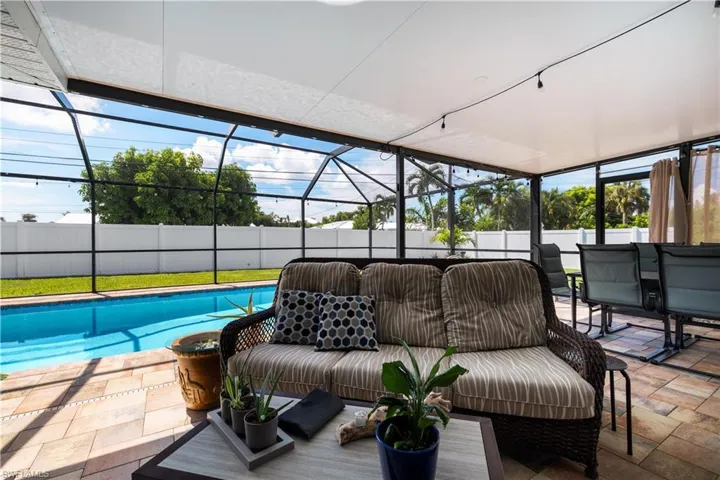 Lanai area with ample seating to enjoy the Florida ourdoor lifestyle. Beautiful pool!