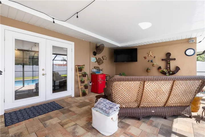 Door from Kitchen to your covered lanai area by the pool.  Super for relaxing and entertaining and a wealth of natural light.