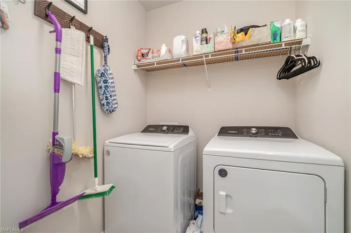 Laundry area featuring washer and clothes dryer