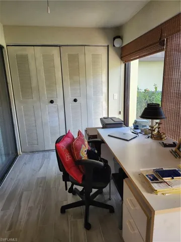 Office area featuring wood tiled floors