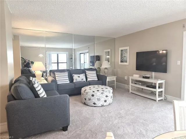 Spacious living room with Gulf view dining area