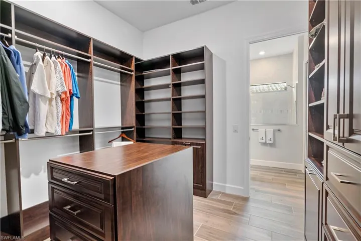 Walk in closet featuring light hardwood / wood-style flooring