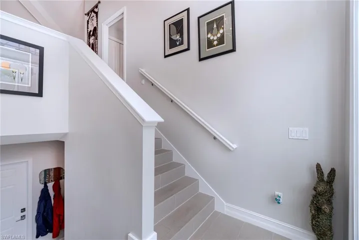 Foyer leading up to main level or down to garage and storage closet
