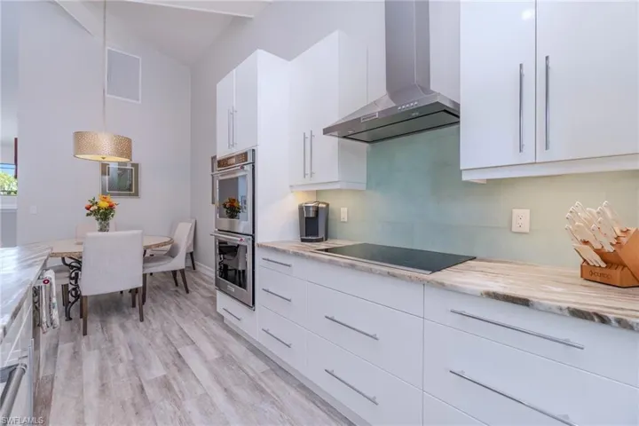 Kitchen with high-end wall ovens and cooktop