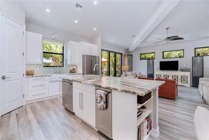 Open concept kitchen, dining and living area