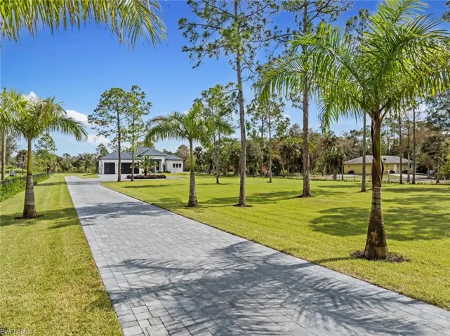 View of property's community featuring a yard