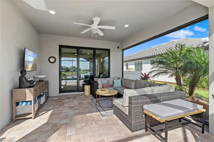 View of patio featuring outdoor lounge area and ceiling fan