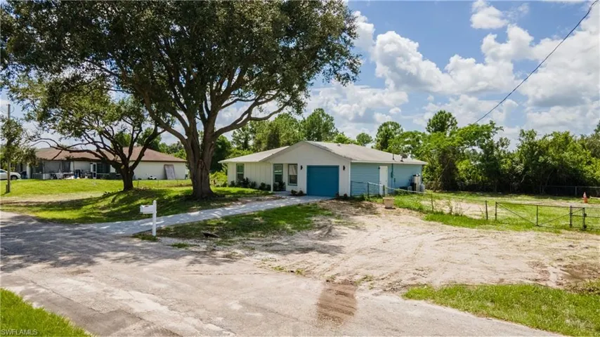 Bungalow-style home with driveway and an attached garage