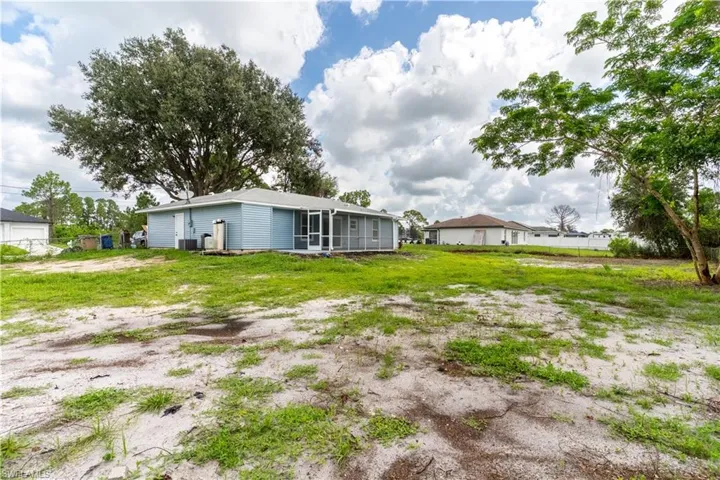View of yard with a sunroom