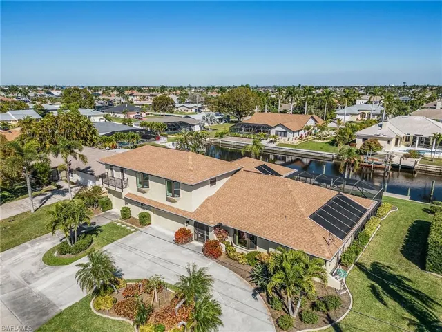 4 car size garage is completely air conditioned....3 car is under central air and the one car at the end with overhead doors to back yard and driveway has window unit for climate controlled storage