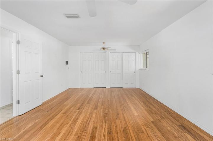 Very large Bedroom #3 downstairs with water view and lots of storage and new wood floors