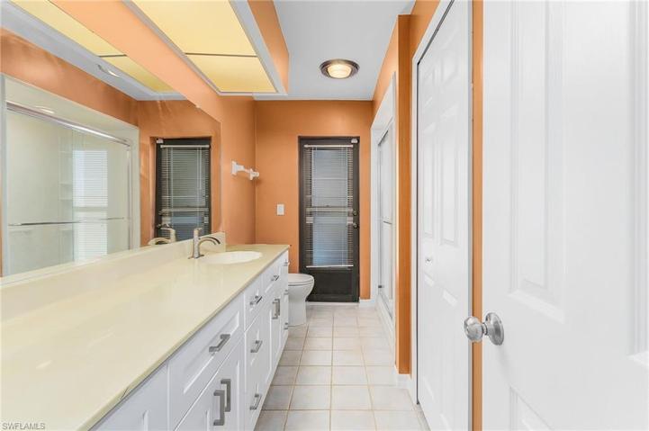 Guest bath with access to the pool and huge linen closet and lots of cabine storage