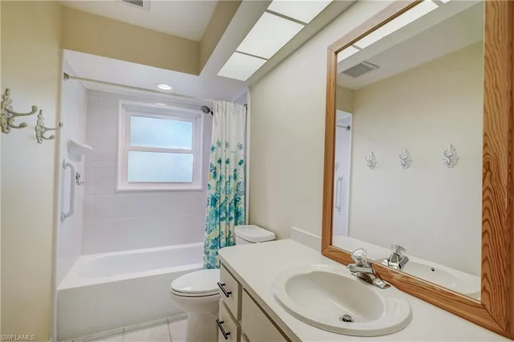 Guest bathroom with tub/shower combo.