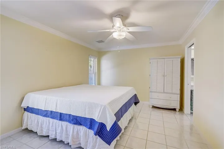 Primary bedroom is located in the rear of the home, next to the living area.