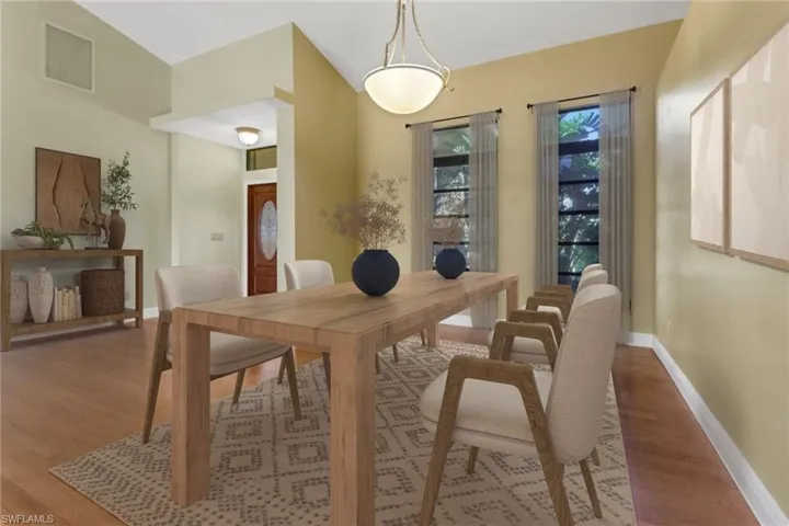 Dining area with hardwood / wood-style flooring