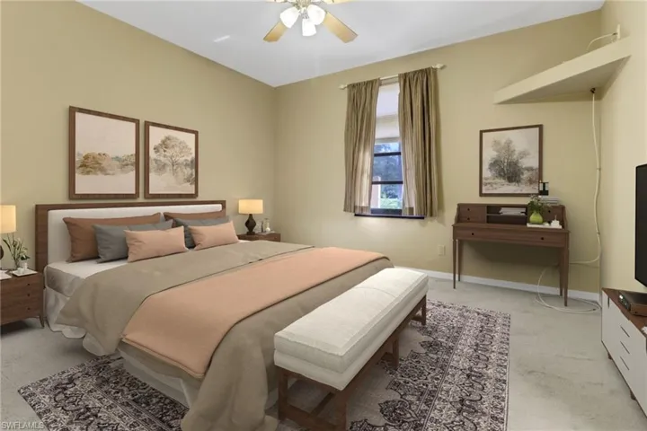 Carpeted bedroom with ceiling fan