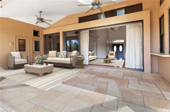 View of patio featuring an outdoor living space and ceiling fan