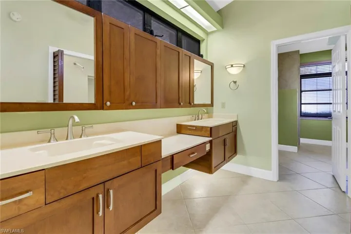Bathroom with vanity and tile patterned floors