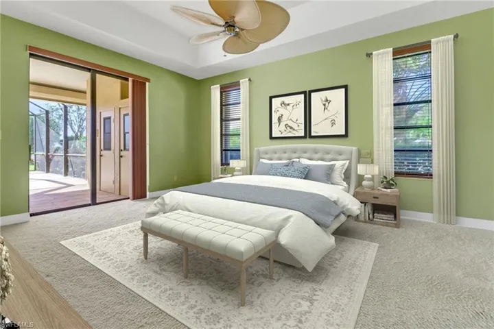 Carpeted bedroom with multiple windows, access to outside, and ceiling fan