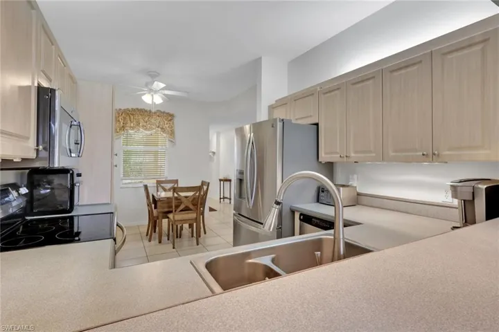 Features stainless steel appliances, sink and upgraded faucet