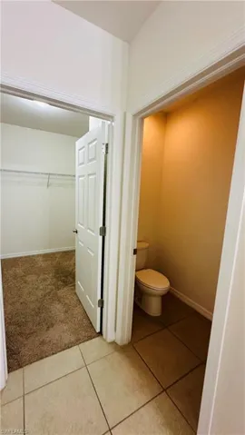 Bathroom featuring tile patterned floors and toilet