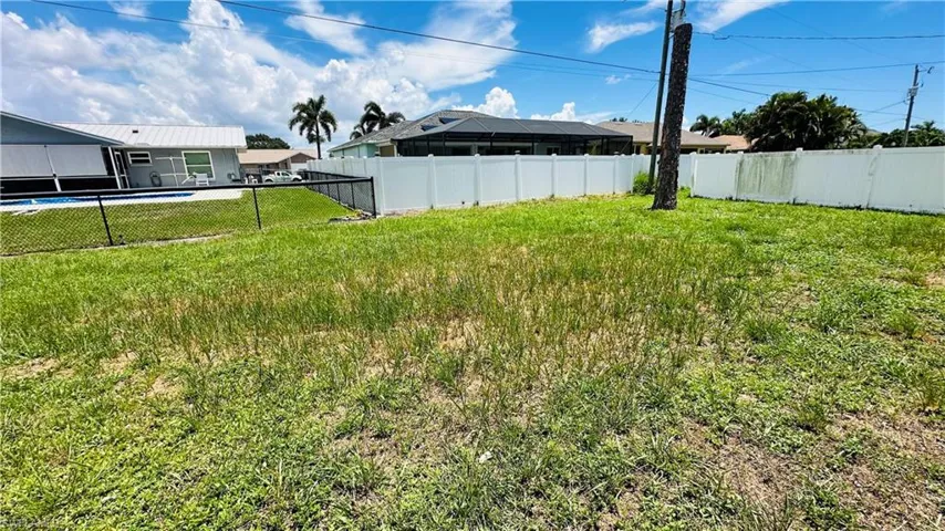 View of fenced backyard
