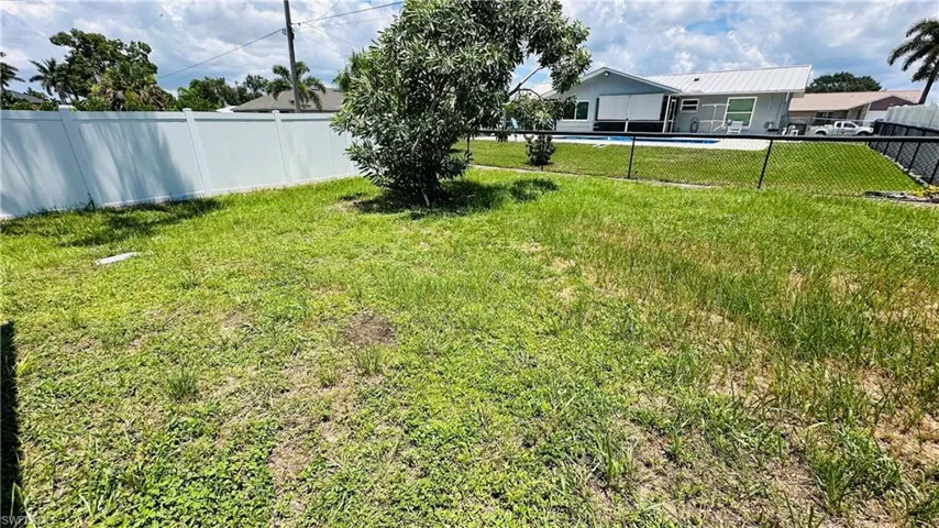 View of fenced backyard