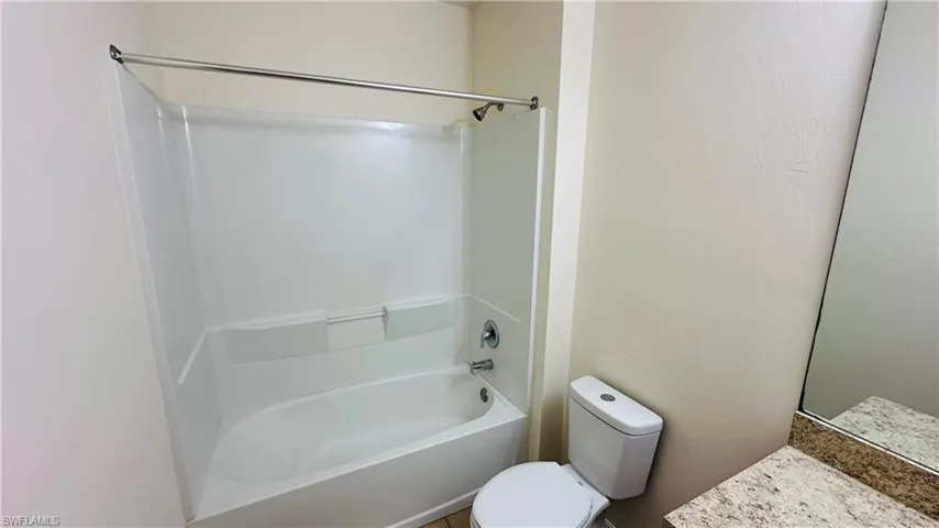 Full bath featuring shower / bathtub combination and vanity