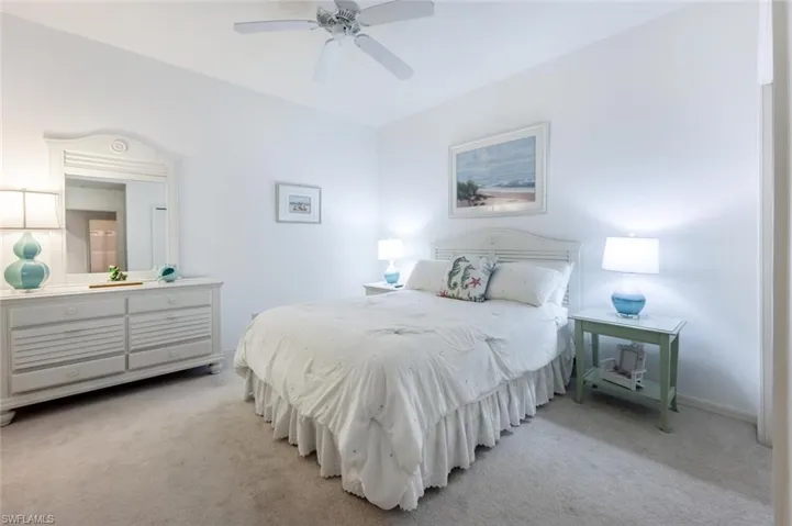Bedroom featuring ceiling fan and light carpet