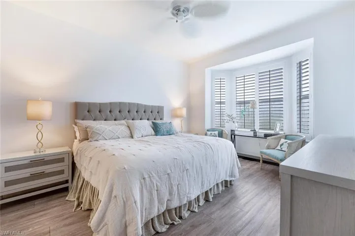 Bedroom featuring hardwood / wood-style flooring and ceiling fan
