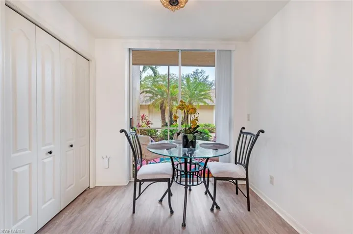 Dining area with light wood-type flooring