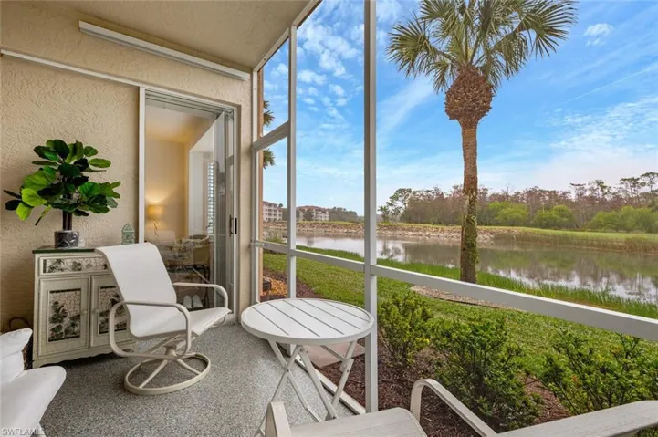 Sunroom with a water view