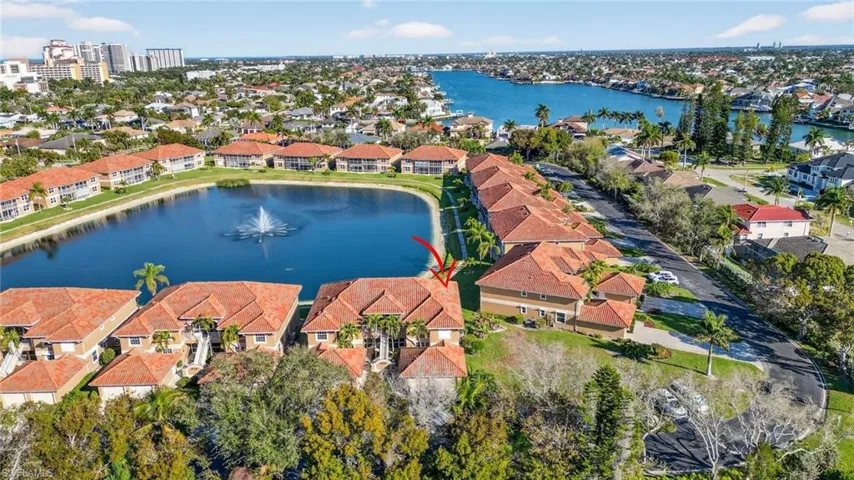 Aerial view of residential area featuring a large body of water