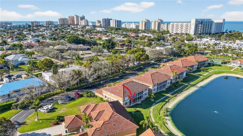 Aerial view of a nearby body of water and skyline
