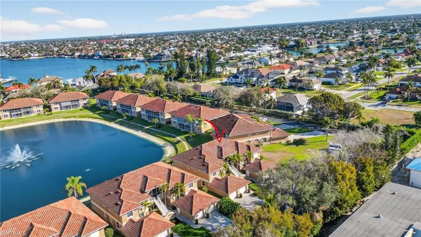 Aerial view of residential area with a nearby body of water