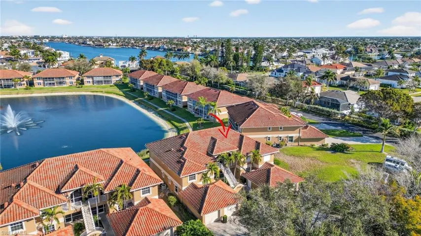 Aerial perspective of suburban area with a large body of water