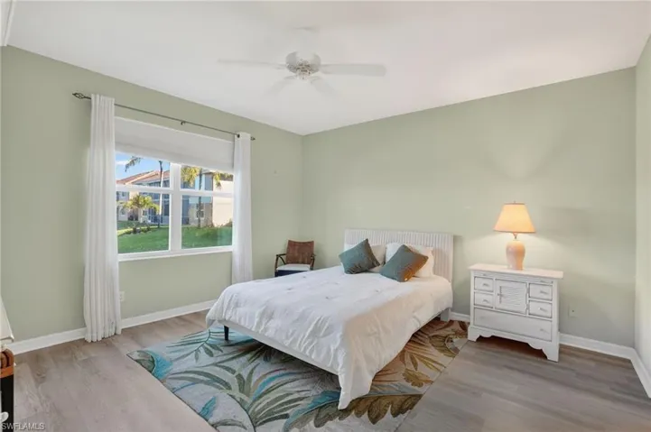 Bedroom featuring light wood-style floors and a ceiling fan