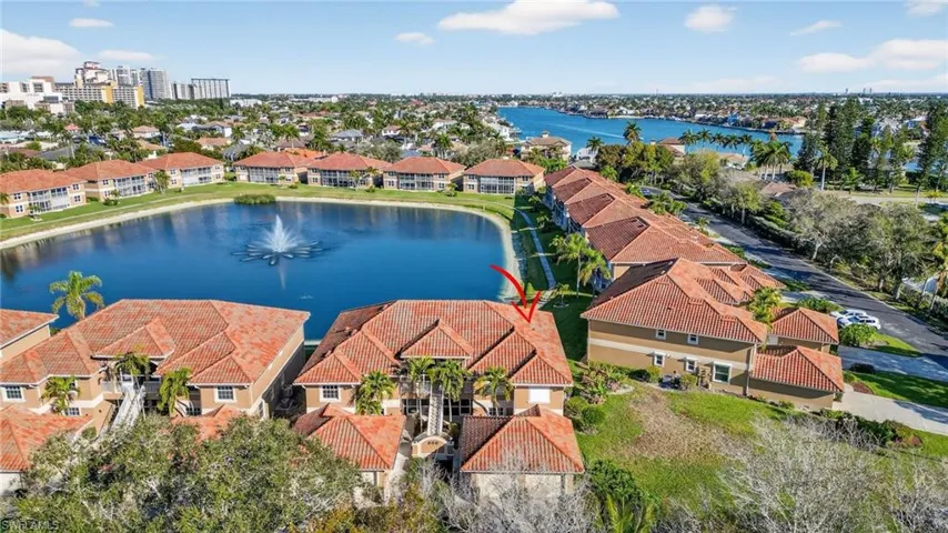 Aerial perspective of suburban area with a large body of water
