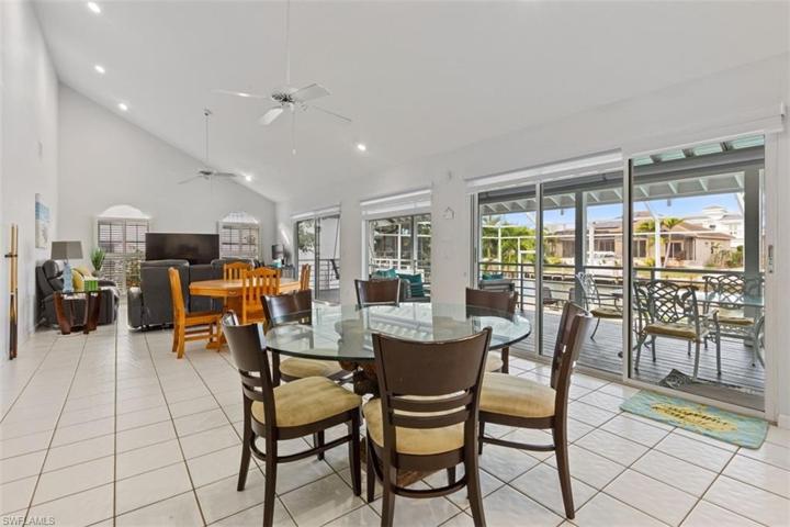 Open concept with sliding doors leading to deck
