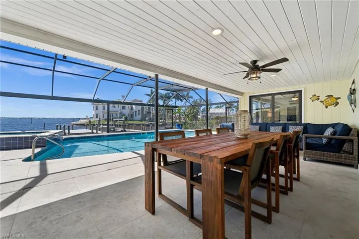 Enjoy relaxing on the covered lanai overlooking the pool and the river