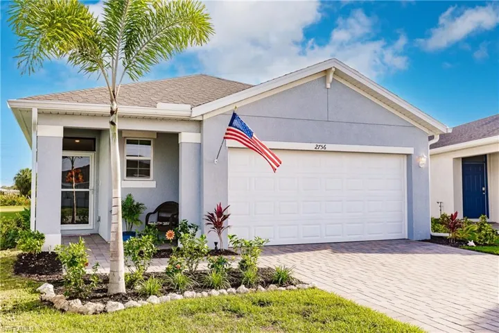 View of front of property with a garage